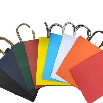 China Recycled Materials Clothes Custom Paper Bag Shopping Bag Paper Boutique Shopping Paper Bags for sale