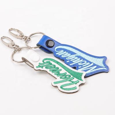 China Daily Used High Quality Custom Letters Logo Keychains Charms Luxury Embroidery Key Chain For Women Girl for sale