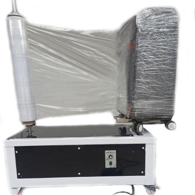 China Manual Airport Food Luggage / Plastic Baggage Stretch Plastic Wrapping Sheet Wrap Machine Maker for sale