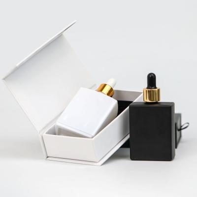 China 50Ml Glass Bottles, 30Ml Square Cosmetic Luxury Flat Square Essential Oil Dropper Rectangle Glass Bottles for sale