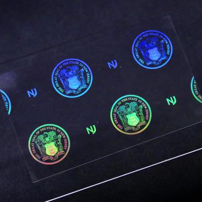 China Anti-Counterfeiting Custom Hologram Sticker Transparent Hologram Covered Foil Seal Holographic Security Sticker Label for sale