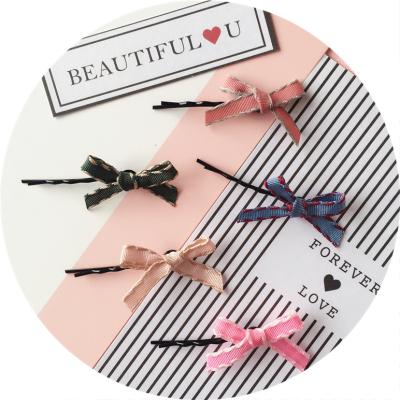 China Cute Bobby Pins For Girls Head Wear Metal Jiris Style Bow Tie Hairpins Sweet Simple Paint Headdress Spray for sale