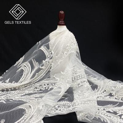 China Breathable 3d Flower Lace Embroidered Fabric Tulle Throw White Gold Sequin Bead Embroidered Wholesale Textile Fabric For Wedding Dress for sale