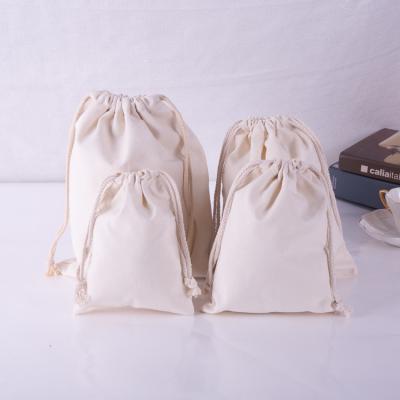 China Reusable beige color canvas drawstring bag with logo printing, low moq drawstring bag customized design for sale