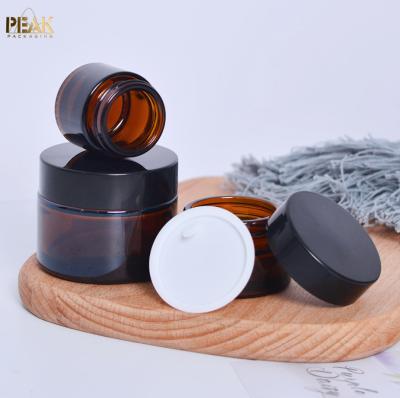 China Small high quality empty cosmetic amber glass cream cream jars 5g 10g 15g 20g 30g 50g 100g for sale