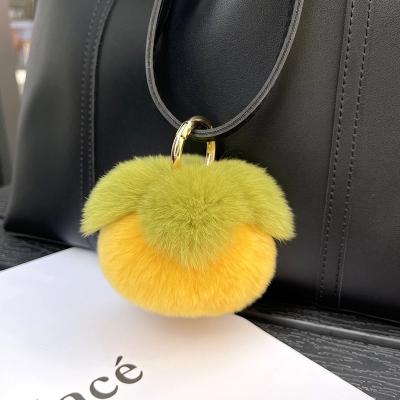 China Trendy Creative Khaki Rabbit Fur Plush Ball Key Chain Pendant Bag Charms Car Key Pendant Gift for sale