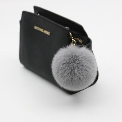 China Handmade wholesale fur ball pom pom bunny puff ball fluffy comic keychains key chain for sale