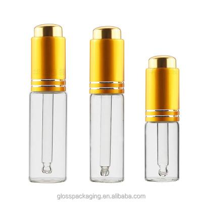 China Cosmetic price clear spiral mouth gold oil rotary cap bottom pressing pump head luxury essence serum dropper glass bottle 30ml for sale