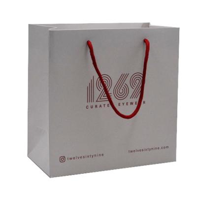 China Recyclable Low Cost Retail Custom Printing Luxury Gift Shopping Apparel Pants Shoes Packaging Paper Bag With Your Own Logo Print for sale