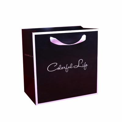 China Recyclable Cheap Printed Food Apparel Packaging Kraft Paper Bags With Your Own Logo Print High Quality Brand Promotion Gift Suitcase For Wigs for sale