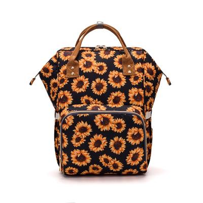 China Outdoor Diaper Bag Multifunctional Fashion Sunflower Print Large Capacity Travel Backpack Mommy Bag Baby Diaper Bag for sale