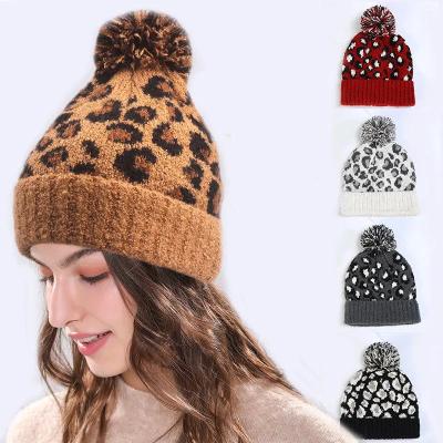 China Fashion Women's Warm Knitted Beanies Fur Ball Cap Pom Pom Beanie Hat For Ladies Thick Leopard COMMON Pattern for sale