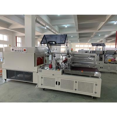 China Food Tissue Box Shrink Wrapping Machine Paper Roll Shrink Packaging Machine for sale