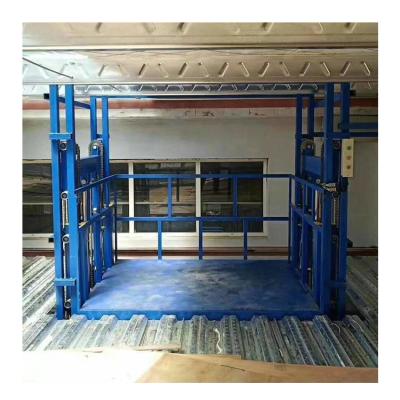 China Building Material Stores Warehouse Use Lift Table Hydraulic Outdoor Lift Table Electric Cage Material Goods Lift For Warehouse for sale