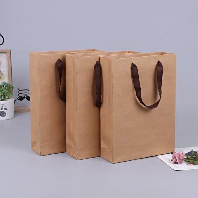 China Recycled Materials Wholesale Cheap Price Logo Kraft Gift Craft Shopping Custom Paper Bag With Your Own Logo For Packaging for sale