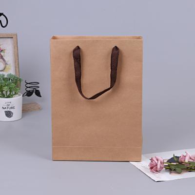 China Custom Recycled Logo Paper Bags Wholesale Clothing Packaging Bags Brown Materials Kraft Paper With Handle for sale