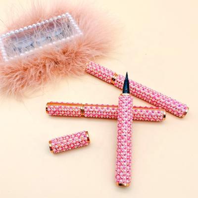 China Quick-drying Tstory 2021 New Pearl glitte Pink Water Activated Lashglue Magnetic Glue Pen Eyeliner Pencil for sale