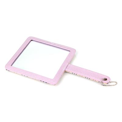 China Magnifying PU Leather Cosmetic Mirror Round Beautiful Small Portable Mirror for sale