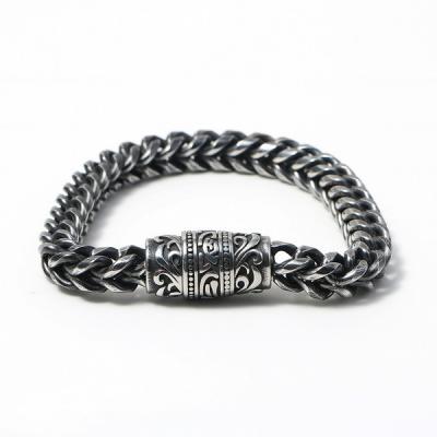 China Stainless steel men's bracelet with retro patterned surface cast magnetic buckle design, trendy accessory for sale