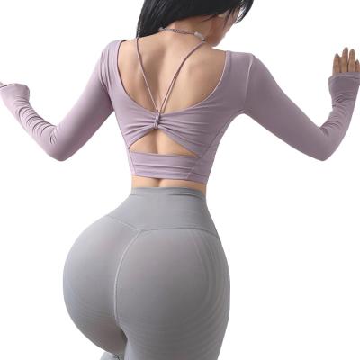 China Breathable Women Girls Fashion Back Compression Hollow Out Soft Fitness Long Sleeve Aerobics Tops With Padded for sale