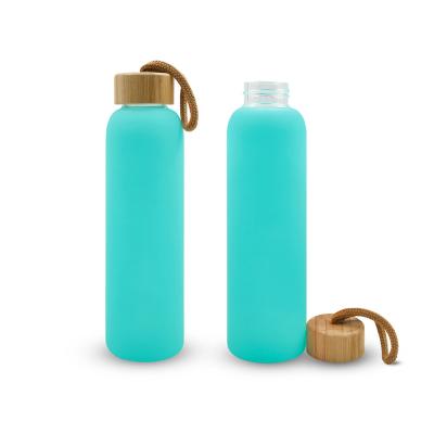 China Sustainable Wholesale DIY 20oz Frosted Multi Color Sublimation Blank Borosilicate Glass Water Bottle With Bamboo Lid And Rope for sale