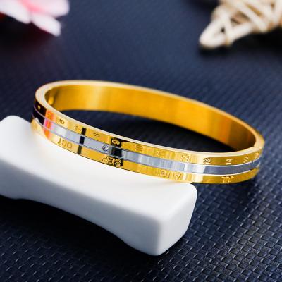 China Custom Girls Gold Letter and Number Engraved Bangle Factory 316L Stainless Steel with Silver Diamond Letter Number Carved Bangle for sale