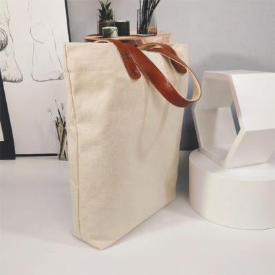 China OEM wholesale custom production printed standard size white cotton finger customized printing logo cotton canvas leather plain empty tote bag for sale