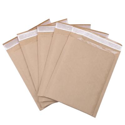 China Customizable Garment Bags Kraft Paper Yellow Chocolate Logo Mailing Envelope Bubble Bag for sale