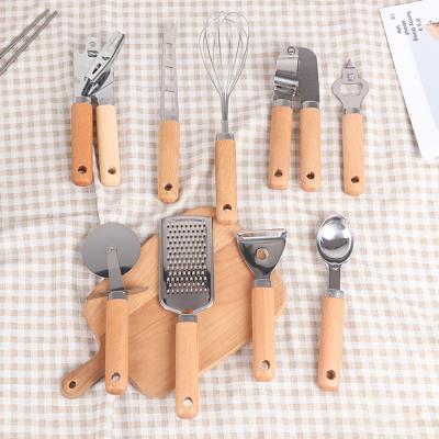 China Amazon Viable Household Hot Selling Items For Kitchen 9pcs Stainless Steel Instrument Accessories Tool Kit Wooden Handles for sale