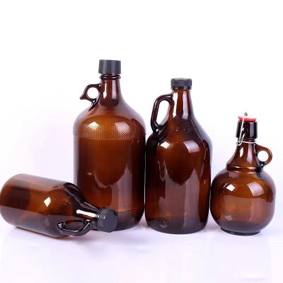 China Beverage 64 Ounce / 2 Liter Amber Sealed Storage Glass Wine Jars Beer Shaker California Glass Wine Bottle for sale