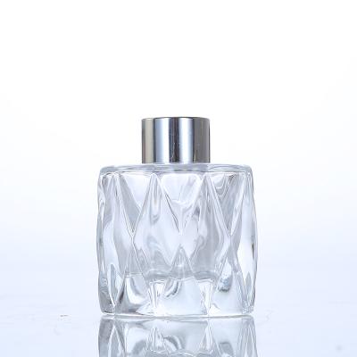 China Sustainable Decorative 200ml Aromatherapy Bottle With Cap Around Shaped Clear Glass Reed Diffuser Car Room Diffuser Bottle for sale