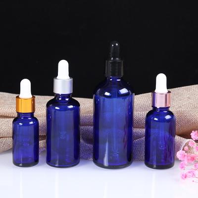 China Euro 5ml 10ml 15ml 20ml 30ml 50ml 100ml Amber Clear Green Blue Glass Essential Oil Round Bottle Cosmetic Round Bottle for sale