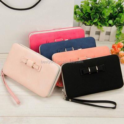 China PU the new Korean version of the lady's wallet has long mobile phone bag, bow tie lunch box, female bag tide for sale