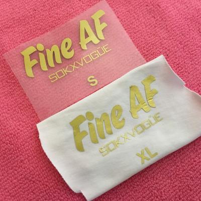 China Durable PET Film Gold Logo Heat Transfer Label , Gold Brand Iron On Transfer Label For Costumes for sale