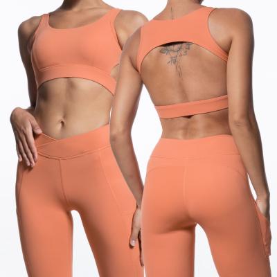 China Custom Breathable Lady 2PC Logo Stretch Leggings Set Woman Breathable Soft Cavity Off Running Sports Tops Legging Suit Yoga Sets And V Waist for sale