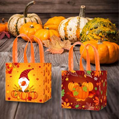 China Xindeli WFF006 Recyclable Thanksgiving Nonwoven Bag with Handles Pumpkin Maple Leaf Sweets Candy Tote Gift Bags for Autumn Party Supplies for sale