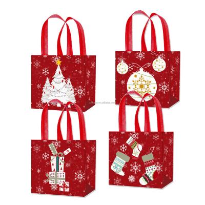 China Xindeli WFF009 4PCS Non-woven Recyclable Christmas Bags Kids Sweets Candy Treat Bags Tote Gift Bags Reusable For Christmas Party Supplies for sale