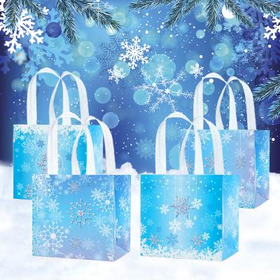 China Xindeli WFF011 Recyclable Christmas Snowflake Nonwoven Bags With Handles Sweets Candy Bags Tote Gift Bags For Winter Wonderland for sale