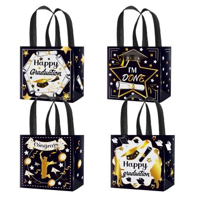 China Xindeli WFF002 4 PCS Recyclable Happy Graduation Nonwoven Bags With Handles Sweets Candy Tote Gift Bags For Congratulations Graduate Party Supplies for sale