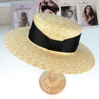 China Hepburn Wheat Straw Hat Popular Fashion Beach Sun Hat Vacation Flat Top Gorras Natural Sunshade Image Style With Wide Ribbon for sale