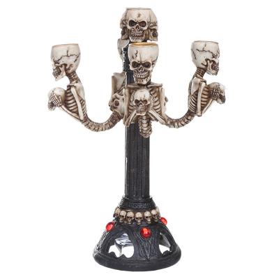 China Home Decoration Originality Resin White Skulls 5 Head Decorative Candlestick Holder Custom Nordic Halloween Tall Candle Holder For The Table for sale