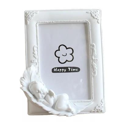 China Resin Sleeping angel resin photo frame creative decorative furniture decoration wholesale resin craft photo frame for sale