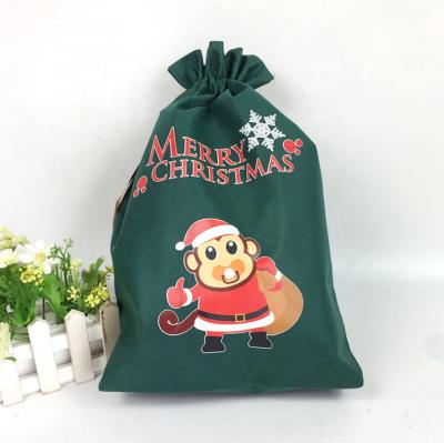 China Christmas anti-theft gift cute design printing small non-woven drawstring bag recycled logo for kids for sale