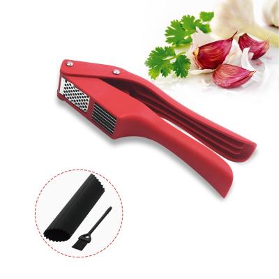 China Viable wholesale hot sale garlic tool crusher pp handle stainless steel garlic press with cleaning brush for sale