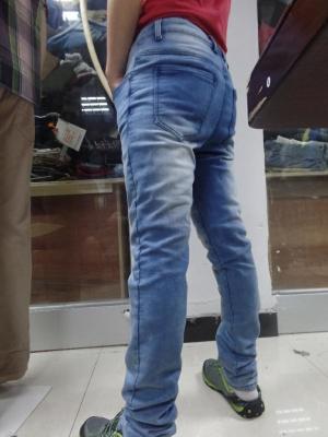 China Special Washed Taper Leg Tight Jeans For Men Patch Ragged Bleaching Denim Jeans for sale