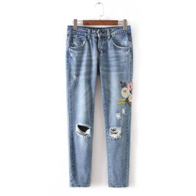 China Flowers Embroidered Womens Tapered Jeans Pants With Holes Wear Comfortable for sale