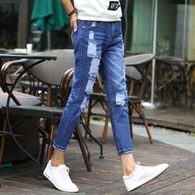 China Printed Denim Womens Slim Straight Leg Jeans With Embroidered Pocket And Holes for sale