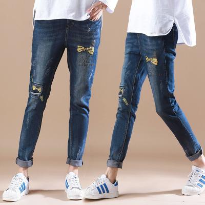 China Summer Womens Printed Denim Jeans Full Elastic Waist Cute Embroidered Pattern for sale