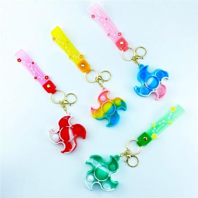 China 2022 Eco-frinedly Rainbow Sun Keychain Silicone Key Chain Mini Pendant Fidget Toy Squeeze Squeeze Autism Finger Sensory Bubble for sale