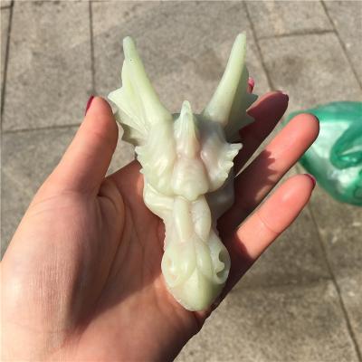 China China Hand Carved Stone Crystal Dragon Skulls Crystal Dragon Head Carving Artificial Luminous for sale